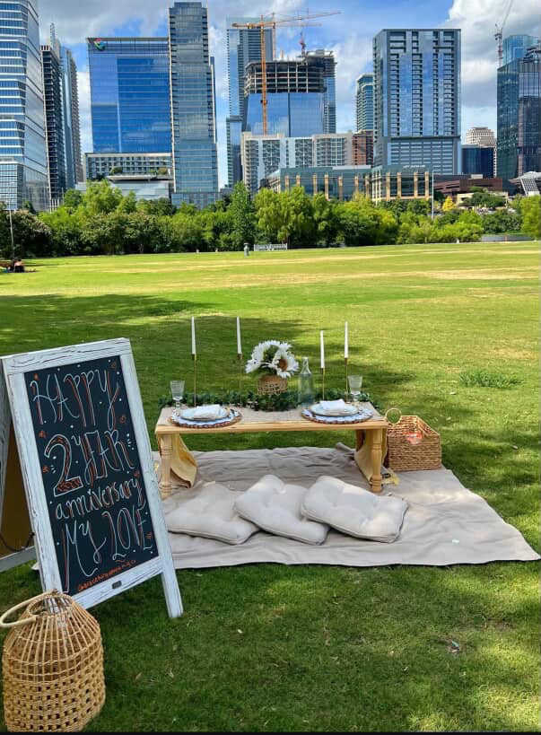 The Neutral Boho picnic theme with an anniversary sign